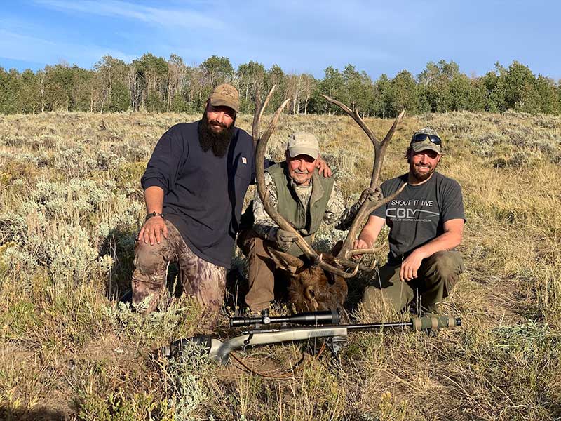 Hunters with elk