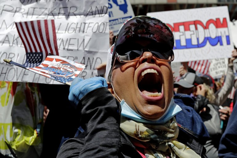 Virus Outbreak Illinois Protest