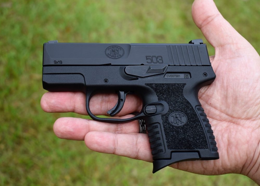 A small black 9mm handgun, the FN 503