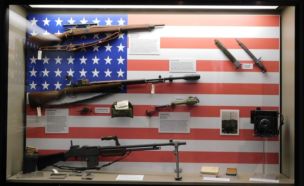 U.S. military firearms of WWII, including the M3 Grease Gun and Thompson M1 submachine guns, the M1 Carbine, the "Liberator" single-shot .45ACP pistol, and M1911A1 .45 Government Issue, (Photo: Chris Eger/Guns.com)